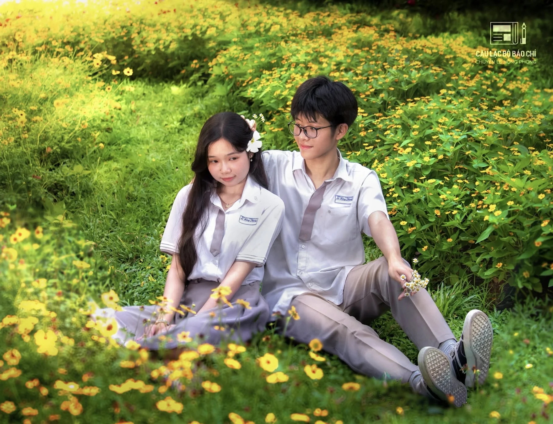 Student portrait among yellow flowers